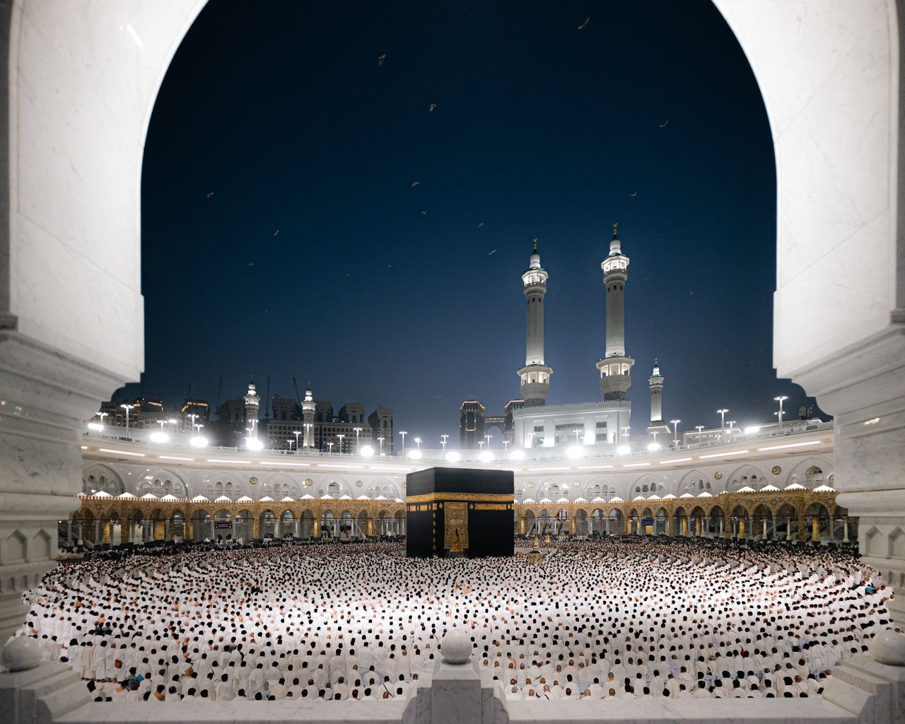 A breathtaking night view of pilgrims at the Kaaba in Masjid al-Haram, Makkah, Saudi Arabia.